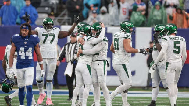 Oct 29, 2023; East Rutherford, New Jersey, USA; New York Jets place kicker Greg Zuerlein (9) celebrates with teammates after kicking the game-winning field goal in overtime against the New York Giants at MetLife Stadium.
